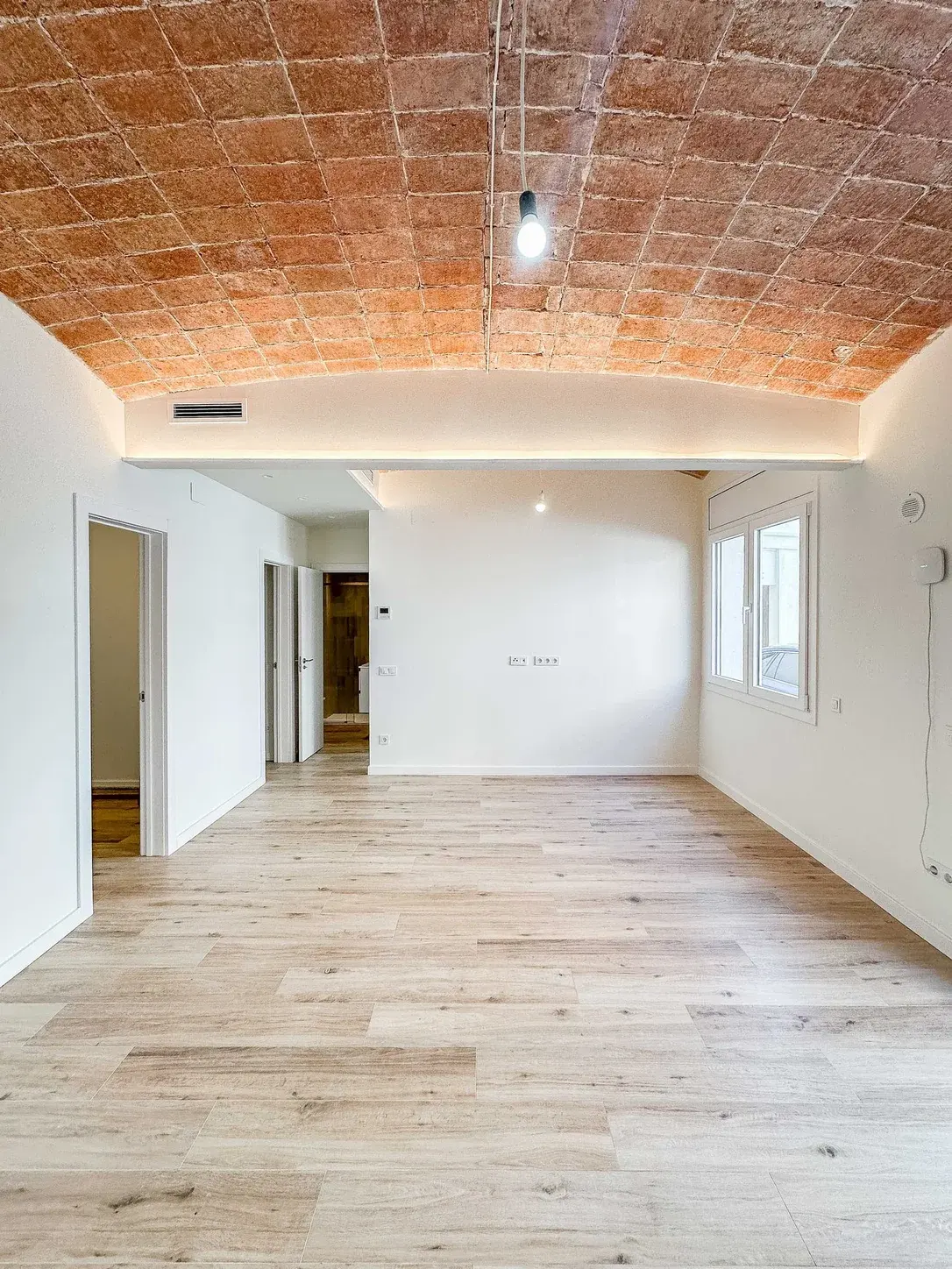 The bare, unfurnished living room as photographed
